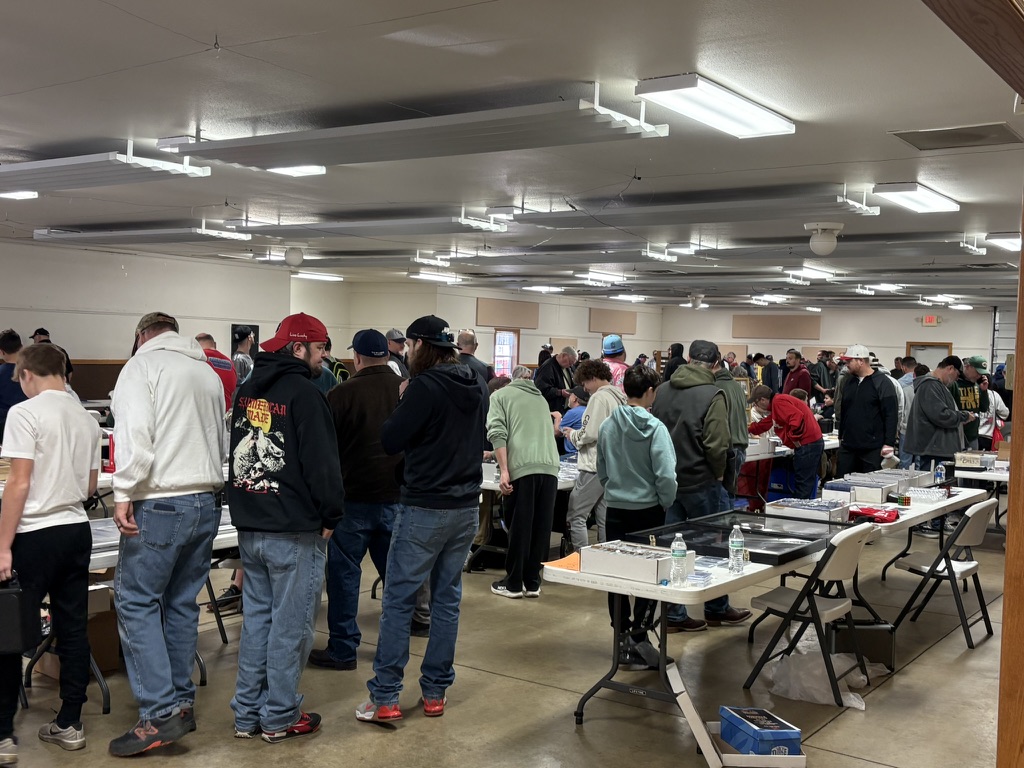 A busy crowd shopping at a Dogtown card show