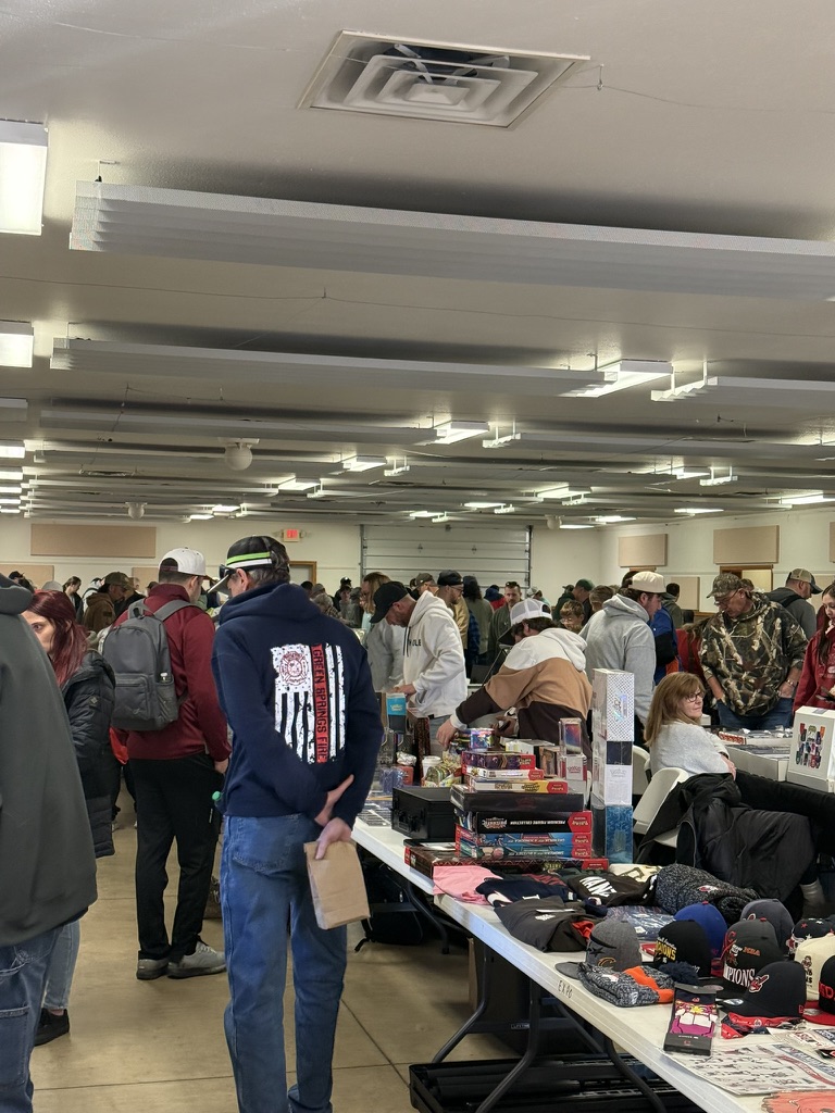 Vendors and collectors gathering around show tables