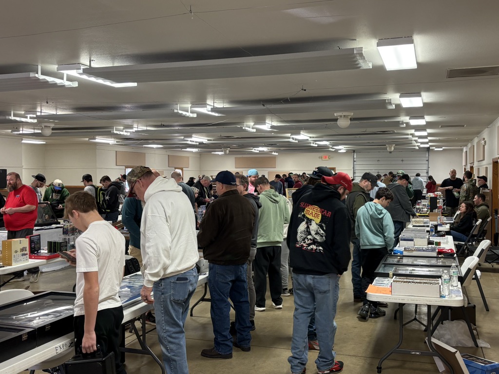 Families and collectors browsing sports cards